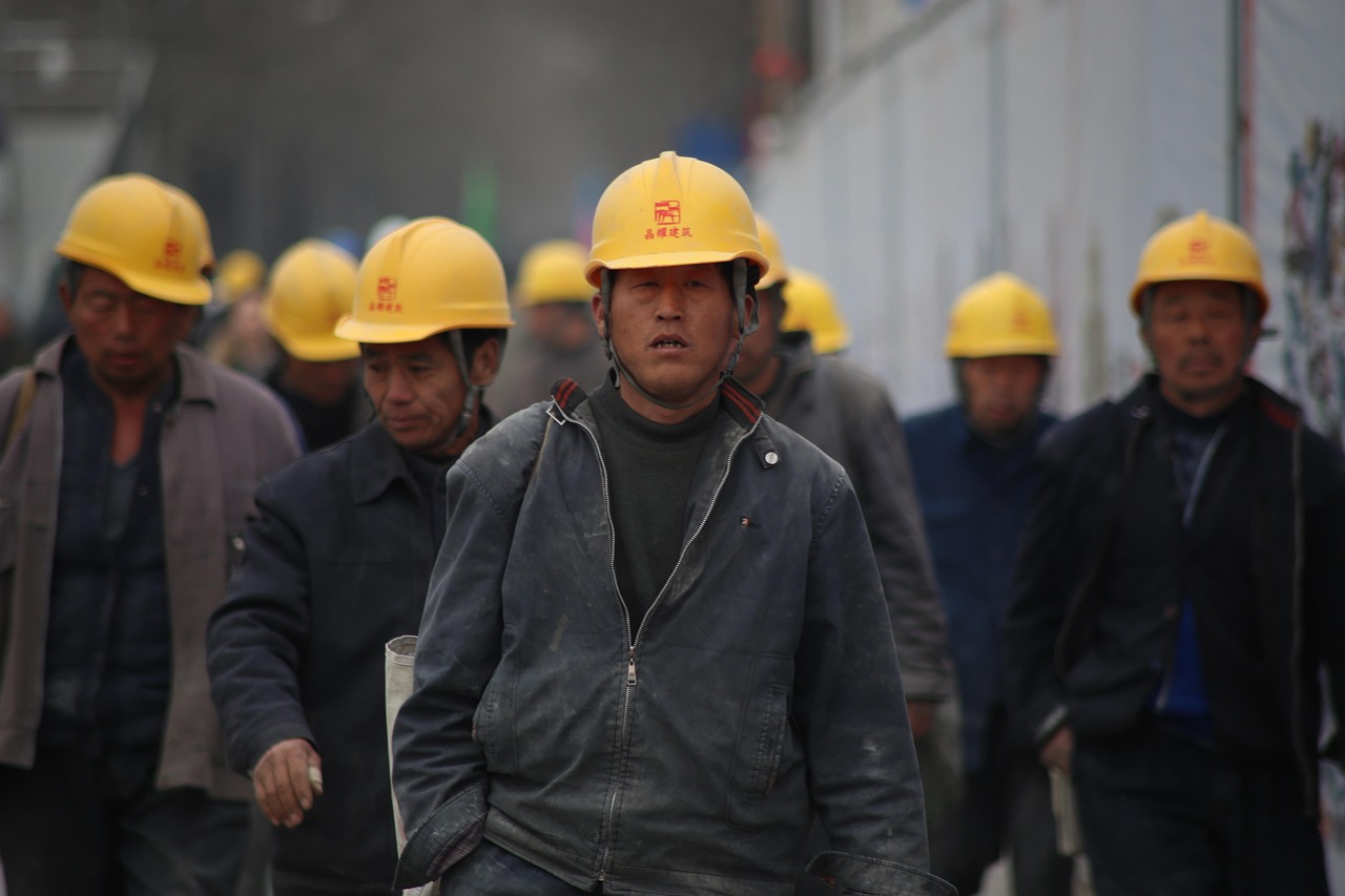 Workers on a commercial job site covered by workers compensation insurance